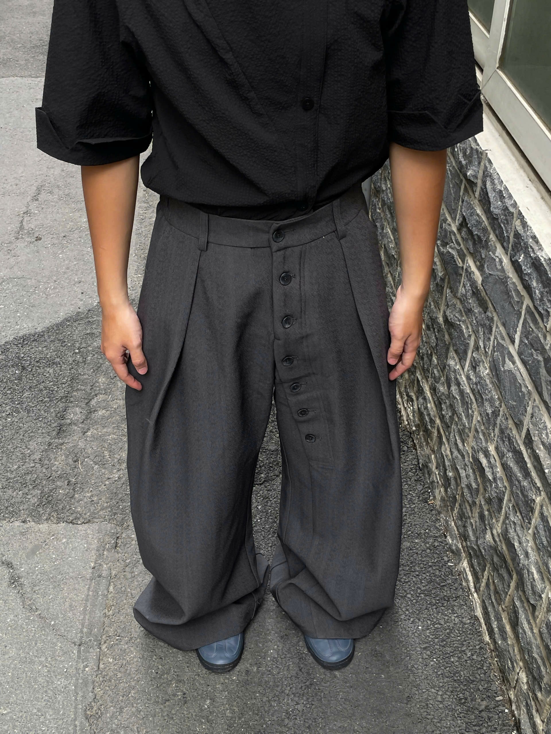 Loose Fit Pleated Buttoned Pants The Futurist Studio