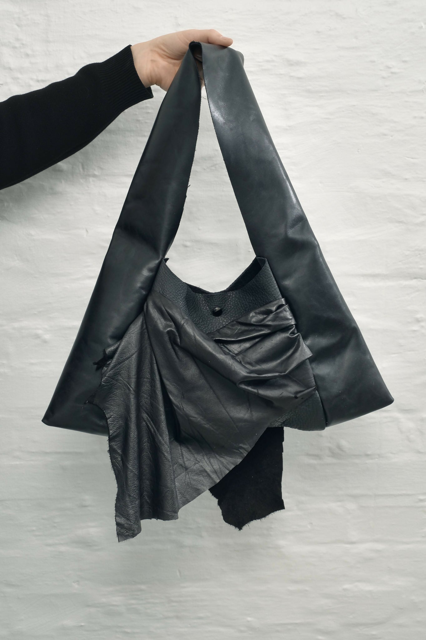 draped raw leather handbag Sahrt